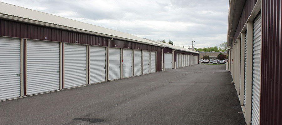 Paved drive between rows of drive-up storage units